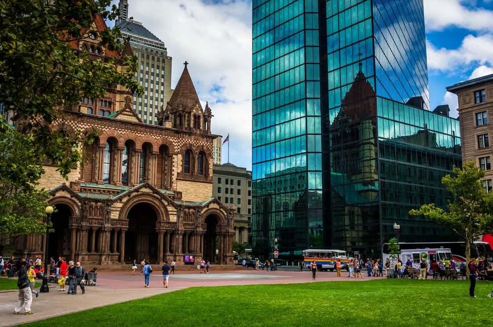 The John Hancock Building and Trinity Church at Copley Square in Boston, Massachusetts. The John Hancock Building and Trinity Church at Copley Square in Boston, Massachusetts.